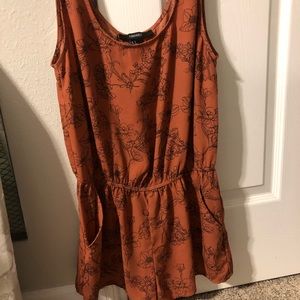 Orange red color romper, and black and white dress